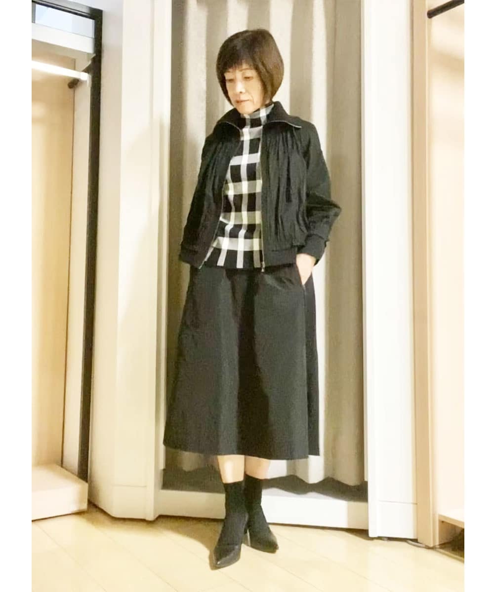 存在感のある大胆なチェック柄が華やかな印象に