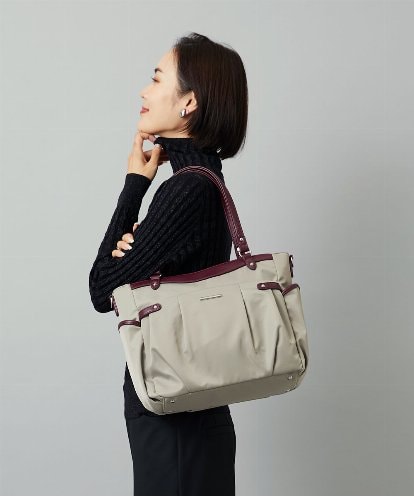 BKRAD31180 MK MICHEL KLEIN BAG [撥水/2WAY]サイドポケットパイピングバッグ