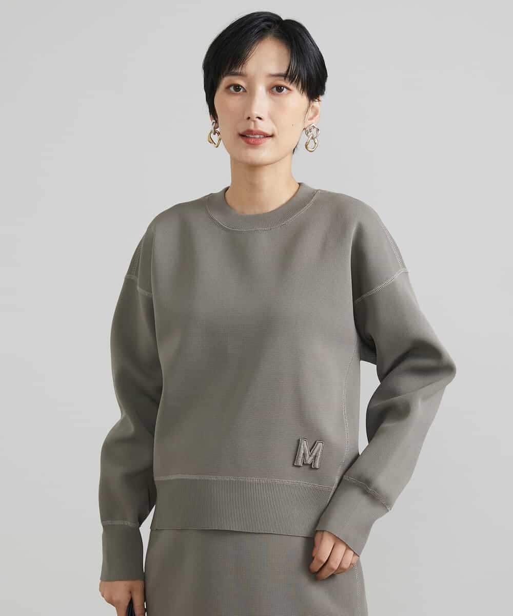 FMFAV37190 MICHEL KLEIN(ミッシェルクラン) スポンディッシュポリワッペン付きニット（セットアップ対応） ブラック(94)