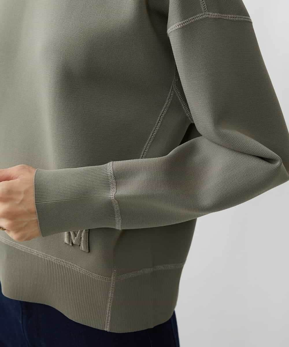 FMFAV37190 MICHEL KLEIN(ミッシェルクラン) スポンディッシュポリワッペン付きニット（セットアップ対応） ブラック(94)
