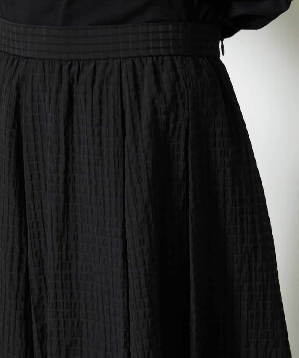 FMHJA05250 MICHEL KLEIN(ミッシェルクラン) [セットアップ対応]トリオシアーチェックフレアスカート ブラック