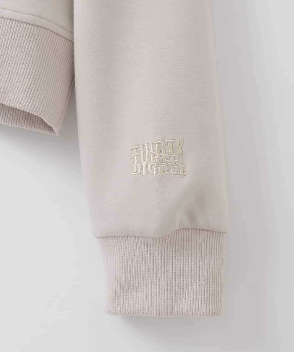 ZMKEE07128 al'aise modulation(アレーズモジュレーション) 箔ロゴラメコードフーディー ベージュ